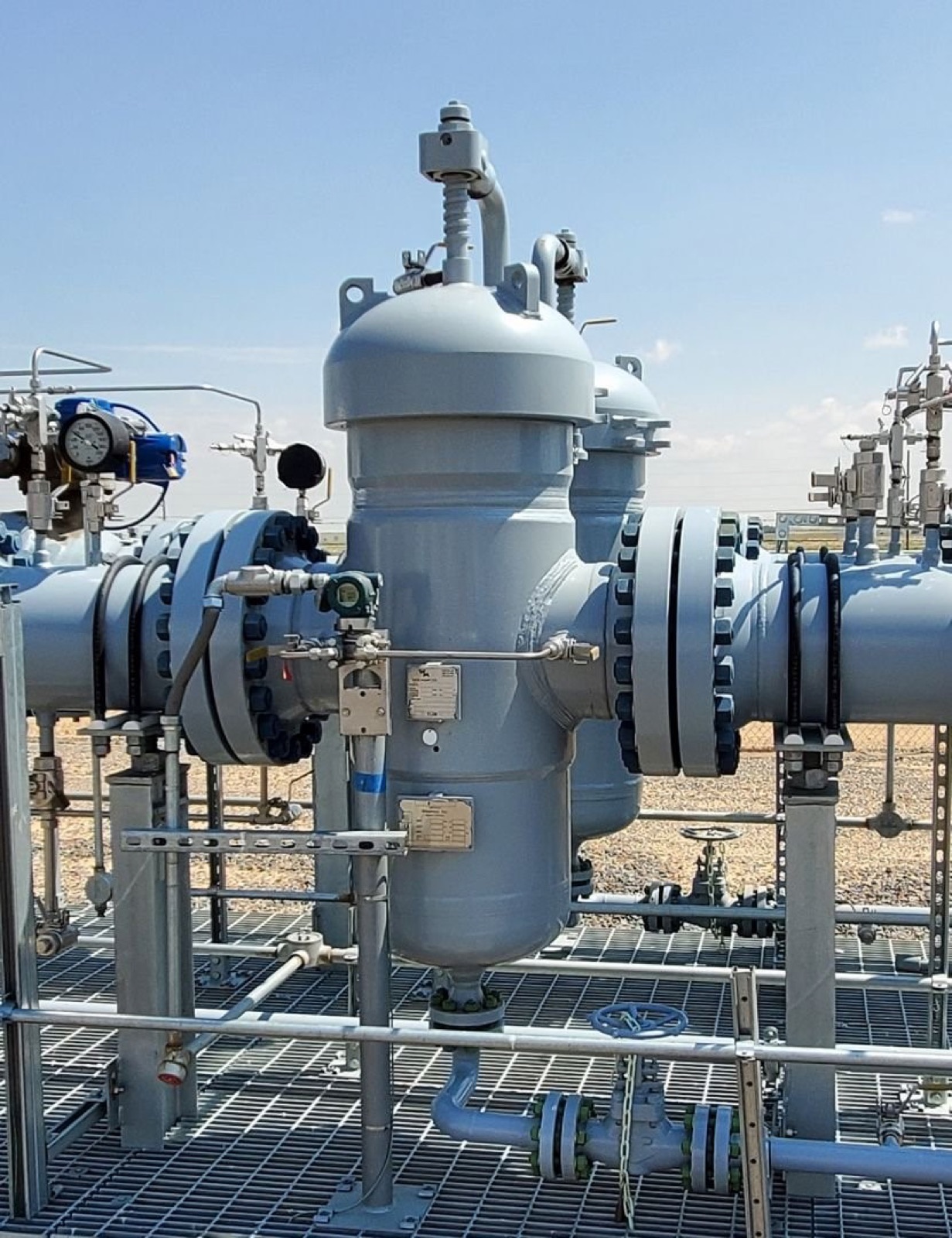 Flanged pipework with valves and pressure gauges on an industrial process platform